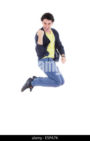 Excited energetic successful man jumping of joy with proud expression showing clenched fist Stock Photo