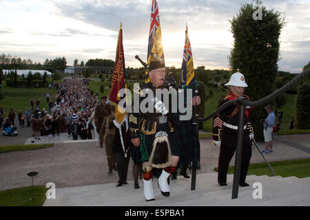 Alrewas, Staffordshire, UK. 4th Aug, 2014. National Memorial Arboretum. Piper Duncan Thompson leads members of the Royal British Legion National Memorial Arboretum Branch up the steps to the Armed Forces Memorial at the start of the service and candlelit vigil to mark the centenary of the start of WW1, the Great War to honour fallen ones.  Credit:  Richard Franklin/Alamy Live News Stock Photo