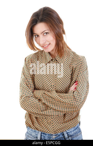 Portrait of smiling beautiful young woman in brown shirt and jeans posing on white Stock Photo