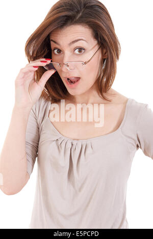 Surprised young woman holding eyeglasses and taking a closer look Stock Photo
