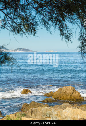 L'Ile Rousse in north Corsica, viewed from the coast of Desert des Agriates Stock Photo