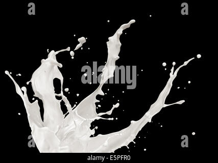 milk or white liquid splash on black background Stock Photo