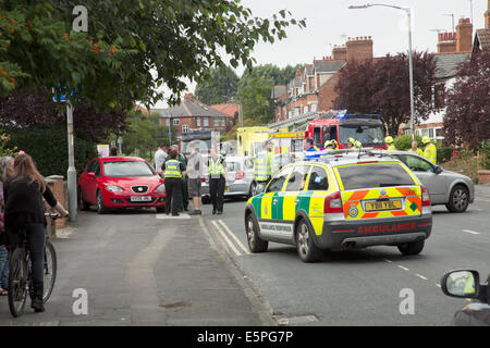 Road accident scene on a busy residential street in York, North Yorkshire, England.