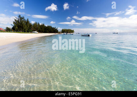 View along Flic en Flac Beach showing the clear shallows of the Indian Ocean, west coast of Mauritius Stock Photo