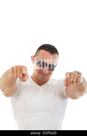 Handsome smiling young man with sunglasses pointing towards camera with both hands Stock Photo