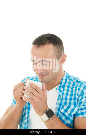 Loving smell of coffee in the morning, Attractive guy holding cup of coffee or tea Stock Photo