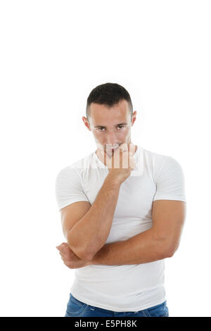 bright picture of handsome serious man in white t-shirt looking in camera Stock Photo