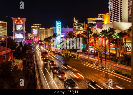 Neon lights, Las Vegas Strip at night with light streaks in front of Caesars, Mirage and Flamingo, Las Vegas, Nevada, USA Stock Photo