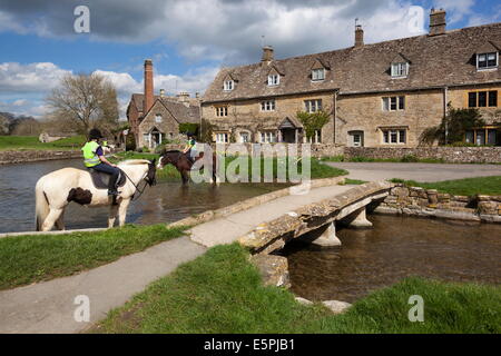 The Old Mill Museum and stone bridge over River Eye, Lower Slaughter, Cotswolds, Gloucestershire, England, United Kingdom Stock Photo