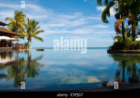 An infinity pool facing the sea at the Lux Le Morne Hotel on Le Morne Brabant Peninsula in south west Mauritius, Indian Ocean Stock Photo