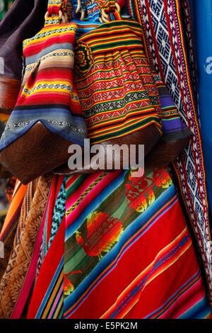 Local carpets made of llama and alpaca wool for sale at the market, Cuzco, Peru, South America Stock Photo