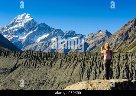 Woman photographing Mount Cook, South Island, New Zealand Stock Photo