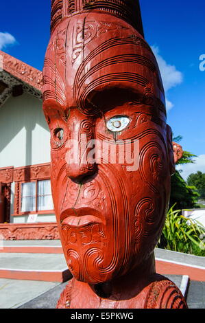 Traditional wood carved mask in the Te Puia Maori Cultural Center, Rotorura, North Island, New Zealand, Pacific Stock Photo