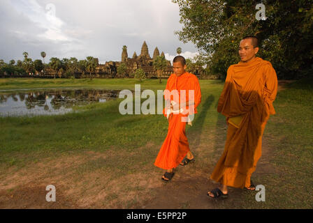 Two Buddhist monks on the outside of the Temple of Angkor Wat. The plan of Angkor Wat is difficult to grasp when walking through
