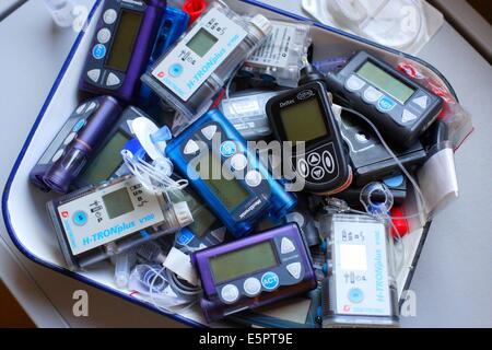 Different external insulin pumps. Stock Photo