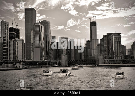 Boats returning from Michigan Lake entering Chicago River Stock Photo