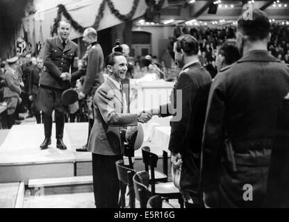 The Nazi propaganda picture shows Joseph Goebbels greeting major general Adolf Galland during a rally at the Sportpalast for the production of arms as well as the political and military situation in Berlin, Germany, June 1943. Reich minister for armament and ammunition, Albert Speer and Colonel-General Heinz Guderian are in the left background. Fotoarchiv für Zeitgeschichtee - NO WIRE SERVICE Stock Photo