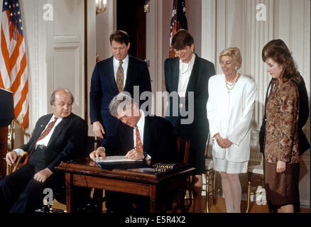 US. 4th Aug, 2014. FILE PIX: United States President Bill Clinton signs the 'Brady Bill' during a ceremony in the East Room of the White House in Washington, DC on November 30, 1993. From left to right: Former White House press secretary James S. Brady; U.S. Vice President Al Gore; President Clinton; U.S. Attorney General Janet Reno; Sarah Brady, wife of James Brady; and Melanie Musick, whose husband was killed by a hand gun. Brady passed away on Monday, August 4, 2014. Credit:  dpa picture alliance/Alamy Live News Stock Photo