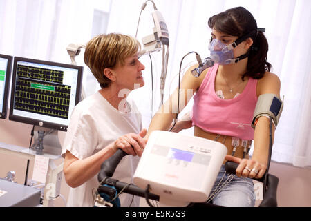 Woman undergoing a stress test and a lung function test, Respiratory diseases department, Limoges hospital, France. Stock Photo