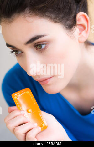 Woman holding the Norlevo morning-after pill (emergency contraceptive pill). Stock Photo