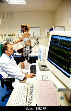 Woman undergoing a stress test and a lung function test, Department of cardiology, Pitie-Salpetriere hospital, Paris, France. Stock Photo