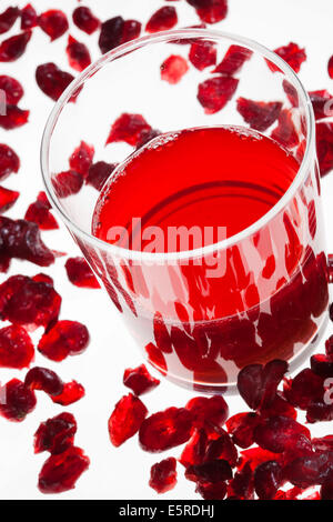 Glass of cranberry juice and dried cranberries for cystitis prevention. Stock Photo