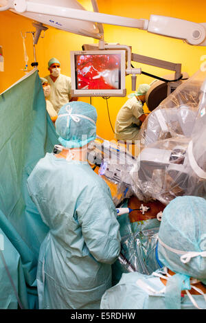 Prostatectomy performed by the telesurgery robot Da Vinci, which four articulated arms and camera are controlled at distance by Stock Photo