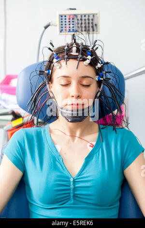 Woman undergoing an electroencephalogram (EEG), Limoges hospital, France. Stock Photo