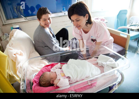 Midwife talking to a mother on a maternity ward, Maternity Stock Photo ...