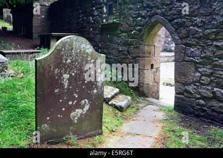 Gravestone and The Devils Door at Old St Marys Church Pateley Bridge North Yorkshire England Stock Photo