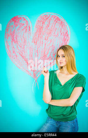 Woman drawing heart. Stock Photo