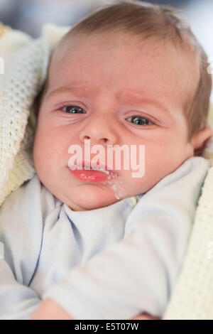 Oesophageal reflux of a 3 month old baby boy. Stock Photo