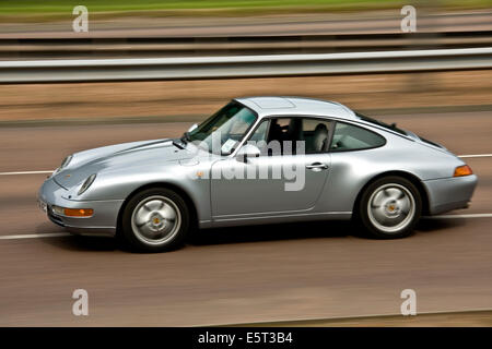 A Porsche 911 Carrera Sports Car travelling along the Kingsway West Dual Carriageway in Dundee, UK Stock Photo