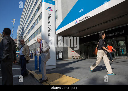 New York, USA. 5th August, 2014.  There is concern about the Ebola virus is in New York City after a man who had recently been to West Africa, went to the emergency room at Mount Sinai Hospital in Manhattan late Sunday with high fever and gastrointestinal problems, the hospital reported Monday.  News crews are camped outside Mount Sinai, and some reporters are asking New Yorkers how concerned they are about the Ebola virus being in New York. Credit:  Scott Houston/Alamy Live News Stock Photo