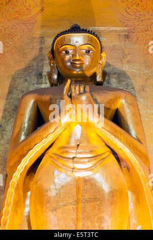 Golden Buddha standing inside of Ananda temple in Bagan Stock Photo - Alamy