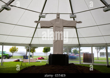 Southport, Merseyside, UK.  5th August, 2014.  Religious Icon, statue, religion, jesus, christianity, church, catholic, religious, christian, christ, sculpture, god, faith, architecture, cross, decorating interior of framed marquee as Flower Show preparations get underway in Victoria Park Southport for the UK’s largest independent flower show. Stock Photo