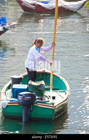 Water Boat Taking On Water In The Causeway Bay Typhoon Shelter, Hong Kong. Stock Photo