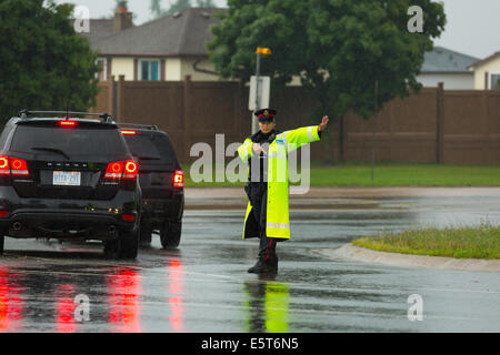 Thunderstorms create flash flooding in Oakville, Ontario turning roads into rivers stranding many & causing millions in damage Stock Photo