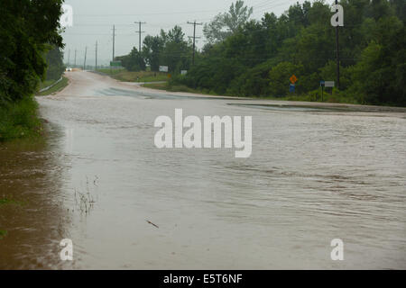 Thunderstorms create flash flooding in Oakville, Ontario turning roads into rivers stranding many & causing millions in damage Stock Photo