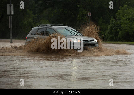 Thunderstorms create flash flooding in Oakville, Ontario turning roads into rivers stranding many & causing millions in damage Stock Photo