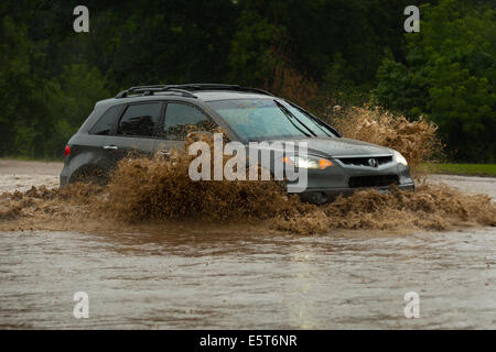 Thunderstorms create flash flooding in Oakville, Ontario turning roads into rivers stranding many & causing millions in damage Stock Photo