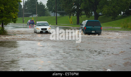 Thunderstorms create flash flooding in Oakville, Ontario turning roads into rivers stranding many & causing millions in damage Stock Photo