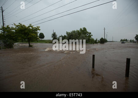 Thunderstorms create flash flooding in Oakville, Ontario turning roads into rivers stranding many & causing millions in damage Stock Photo