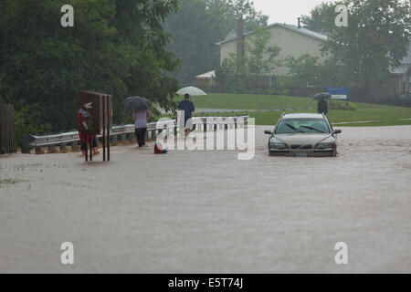 Thunderstorms create flash flooding in Oakville, Ontario turning roads into rivers stranding many & causing millions in damage Stock Photo