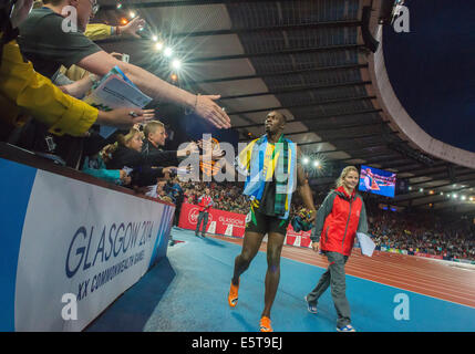 August 2 2014: Jamaican sprinter Usain Bolt delights the Glasgow crowd at Hampden Park. Stock Photo