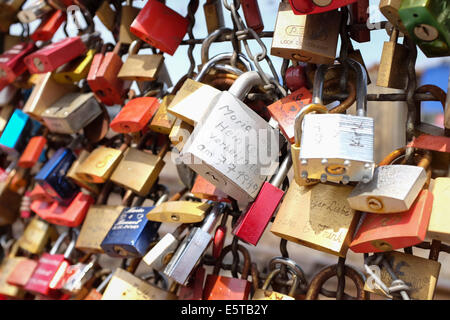 Padlocks symbolizing love forever on the wall of love in the Hohenzollern Bridge in Cologne, Germany Stock Photo