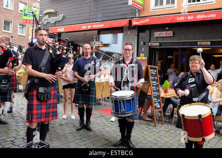 Scottish Pipe Band performing on the streets of Cologne old town, Germany Stock Photo