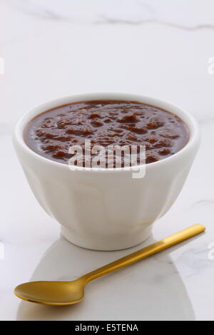 Artisan mexican chipotle sauce on vintage carrara marble table, with a delicious smoky flavor perfect for all your Mexican, tex- Stock Photo