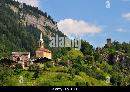 The village church of Trin and the ruins of the Canaschal Castle, Trin, Canton of Graubünden, Switzerland Stock Photo