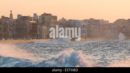The Malecon bathed in evening sunlight, waves crashing against the sea wall, The Malecon, Havana, Cuba, West Indies, Caribbean Stock Photo